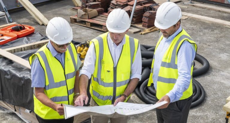 Spetisbury Construction workers consulting building plans