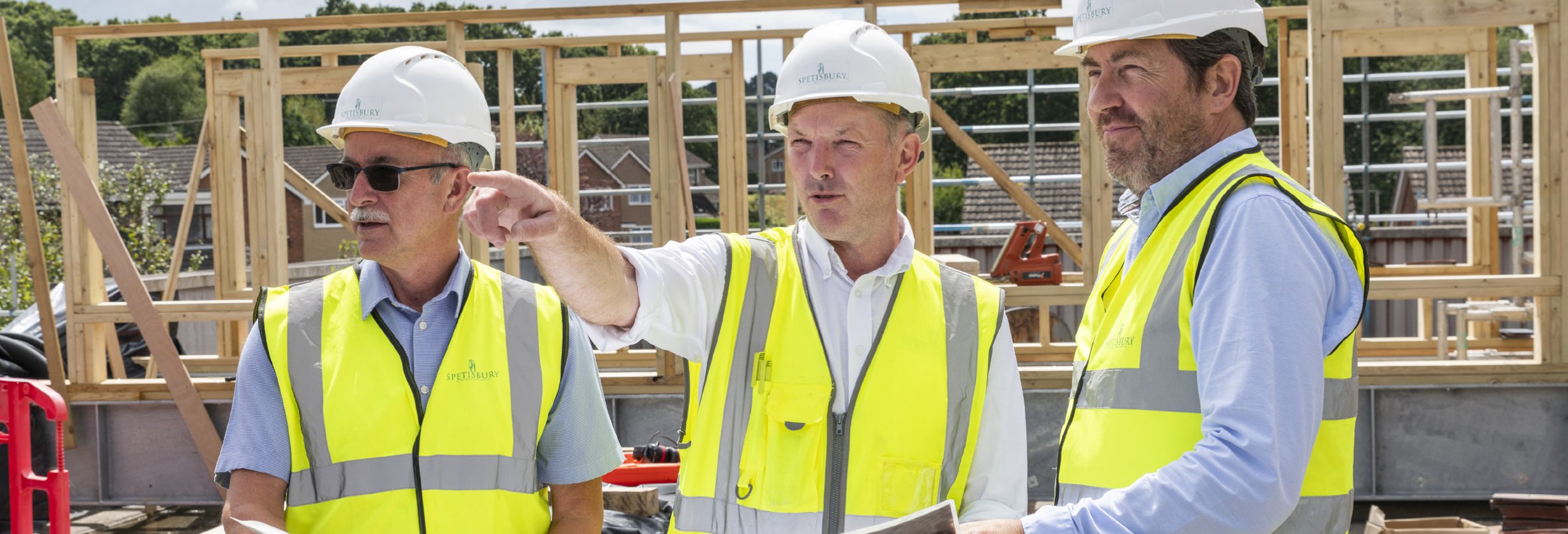 Spetisbury Construction team on-site wearing hard-hats and high-vis vests.