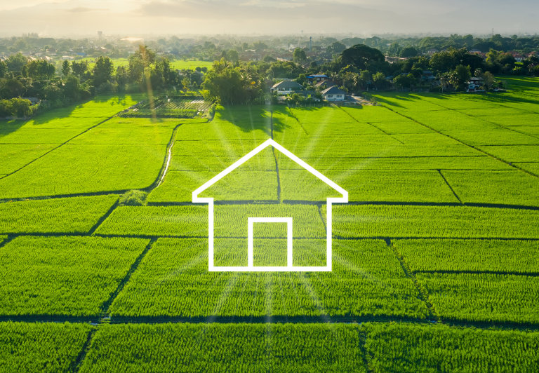 Land or landscape of green field in aerial view. Include agriculture farm, with an icon of residential, home or house building. Real estate or property for dream concept to build, construction, sale and buy.